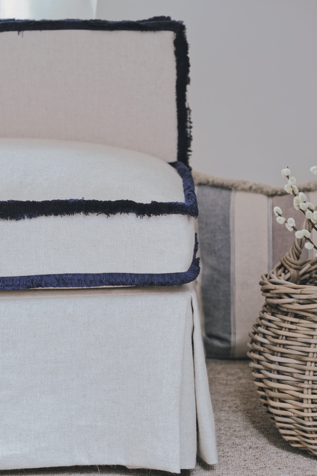 Slipcover detail with navy fringe