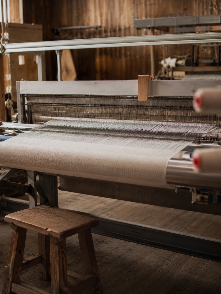 Flax yarn woven into linen on a loom